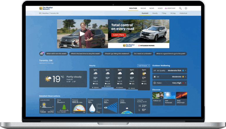 Laptop displaying The Weather Network website with Toronto weather forecast.