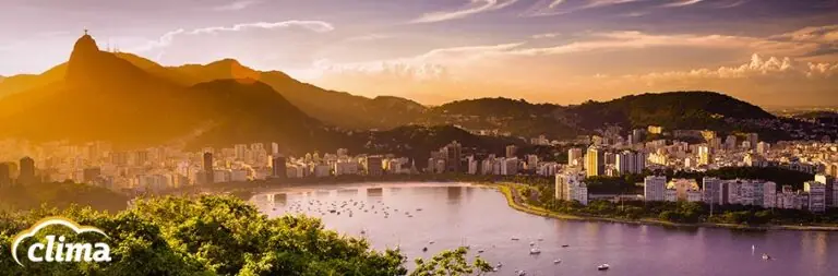 View of mountains and buildings in Rio De Janeiro with Clima logo on top.