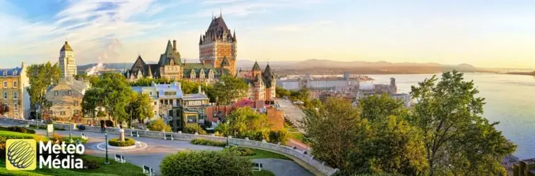 Parliament building, river and mountains in Quebec City with MétéoMédia logo on top.