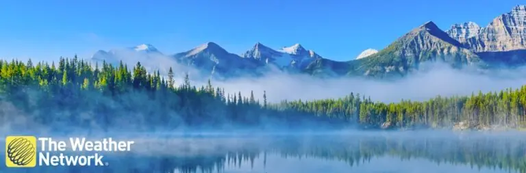 Mountain landscape in Canada with Weather Network logo on top.